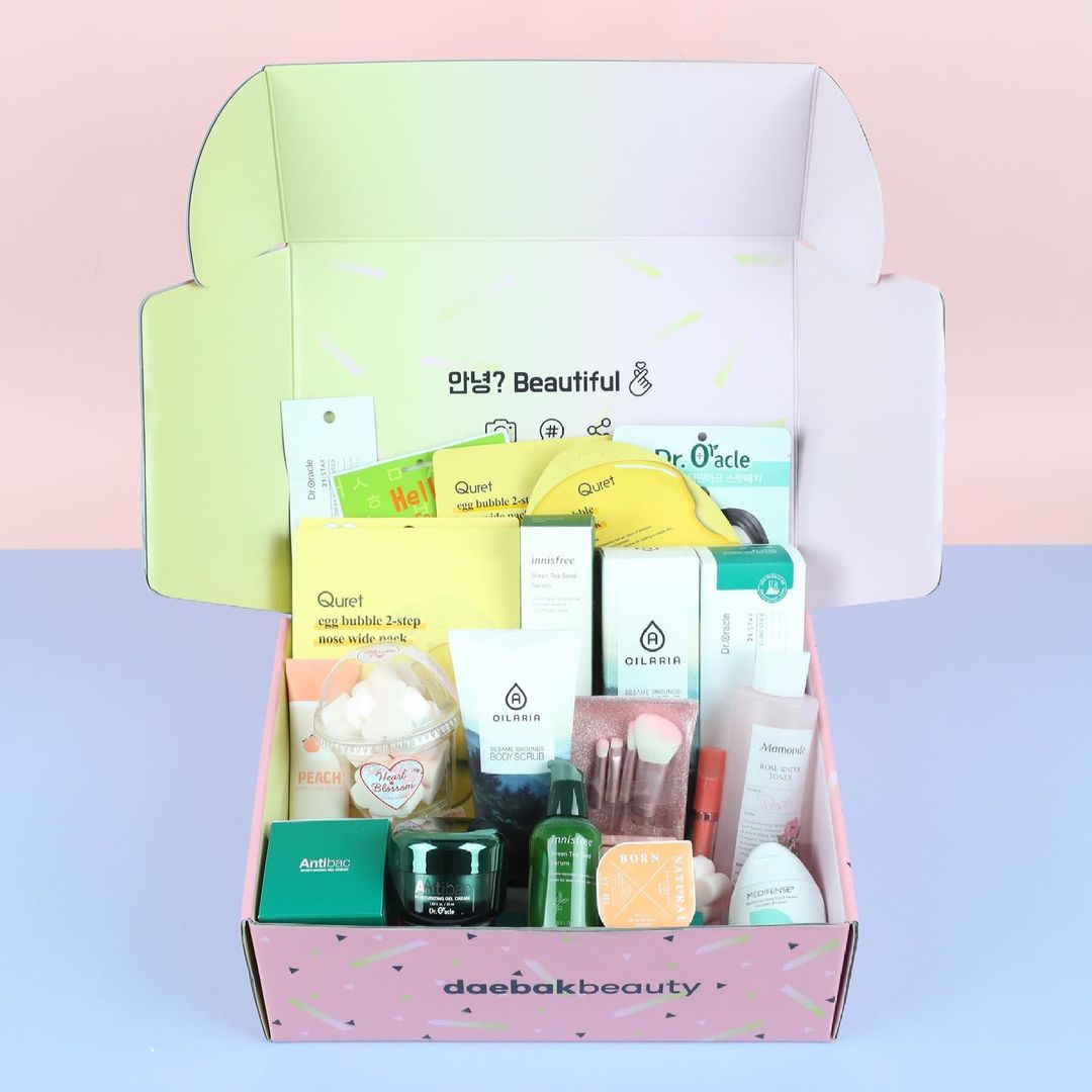 Daebak Beauty Box by The Daebak Company showing an open box with Korean skincare products and beauty items.