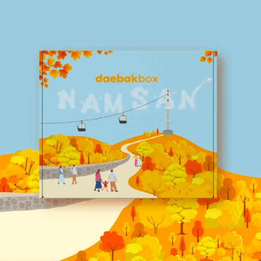 Daebak Fall Box featuring Korean skincare, cozy accessories, seasonal snacks, and lifestyle items in warm, autumn-inspired packaging.