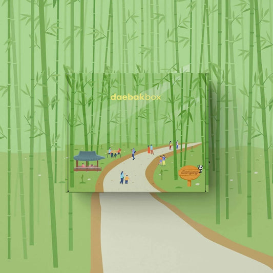 Daebak Summer Box filled with Korean skincare, makeup, snacks, and lifestyle items in vibrant, summer-themed packaging.