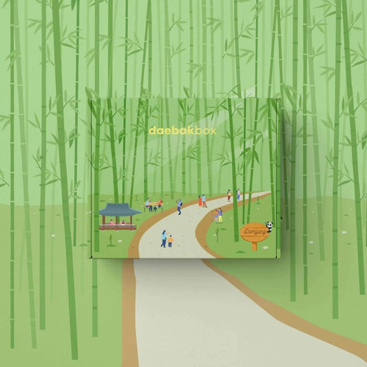 Daebak Summer Box filled with Korean skincare, makeup, snacks, and lifestyle items in vibrant, summer-themed packaging.