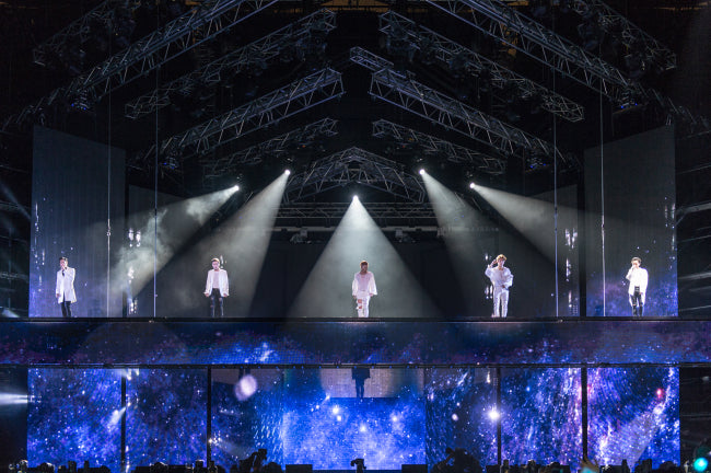 BIGBANG performs at the 10th anniversary 0.TO.10 concert at Seoul World Cup Stadium in 2016 with all five members on stage