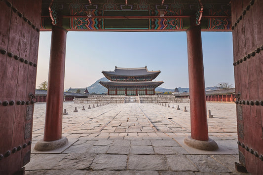 Geunjeongjeon throne hall at Gyeongbokgung Palace displaying brightly colored dancheong painting on its wooden eaves and rafters