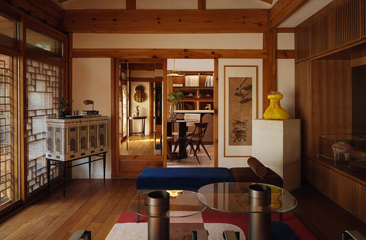 Korean minimalist interior with wood floors white walls low furniture in Teo Yang design