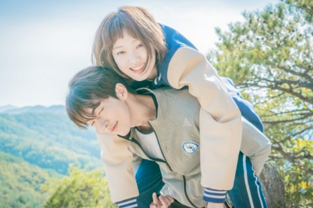 Lee Sung Kyung as Kim Bok-joo from Weightlifting Fairy Kim Bok-joo smiling during a piggyback scene