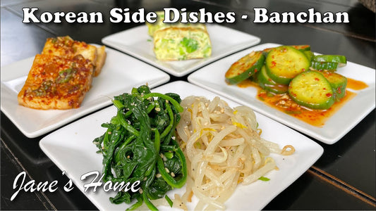 Korean banchan side dishes spread on a traditional table, showcasing the variety and vibrant colors of communal Korean dining culture