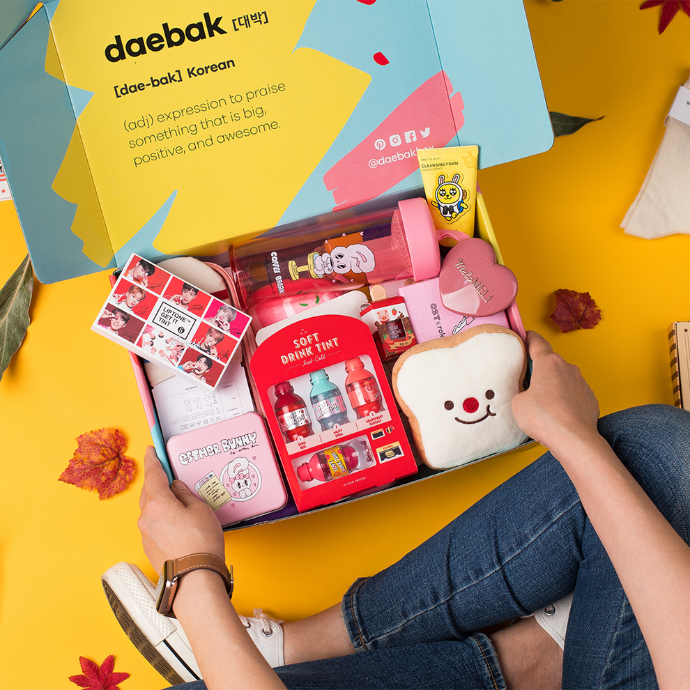 Daebak spring DaebakBox with assorted Korean snacks and treats, featuring colorful packaging and a variety of traditional and modern items.