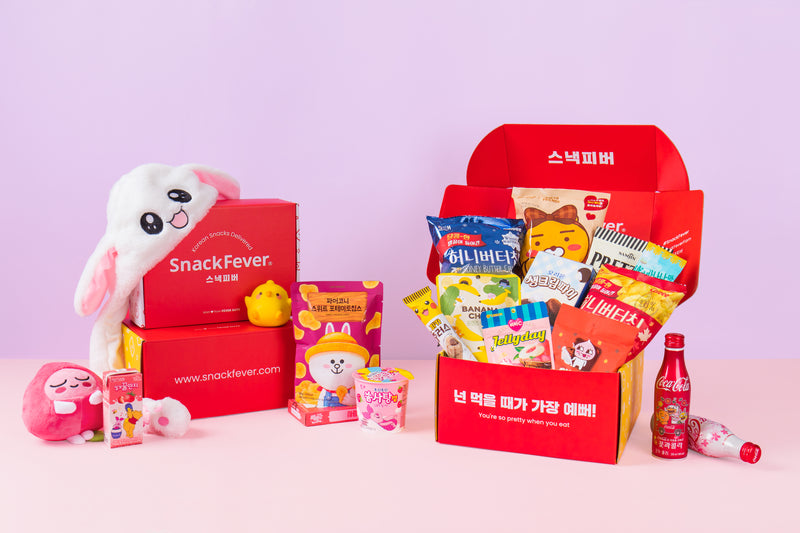 Snack Fever boxes with a bunny hat, plush toys and Korean snacks
