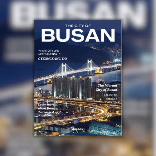 Book cover of 'The City of Busan' with a bridge and cityscape at night.