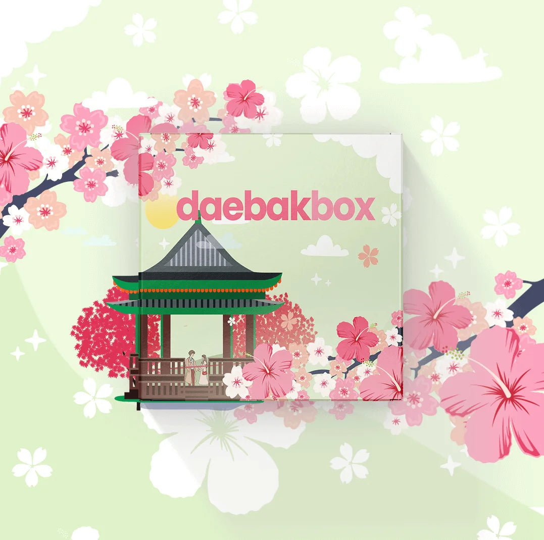 Daebak Spring Box featuring a curated selection of Korean beauty, fashion, snacks, and lifestyle items in bright, seasonal packaging.
