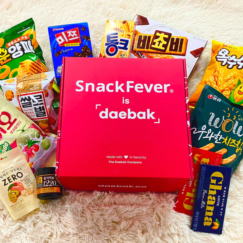 Snack Fever is daebak box surrounded by Korean snacks