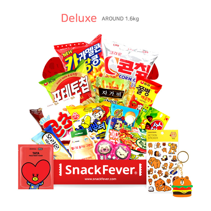 The Deluxe Snack Fever box overflowing with Korean snacks, stickers and a keychain