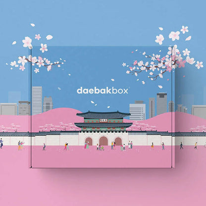 Daebak Spring Box featuring a curated selection of Korean beauty, fashion, snacks, and lifestyle items in bright, seasonal packaging.